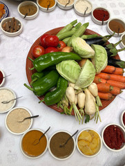 Fresh vegetables, tomatoes, carrots, peppers, cabbage and spices are ready for Asian cooking workshop