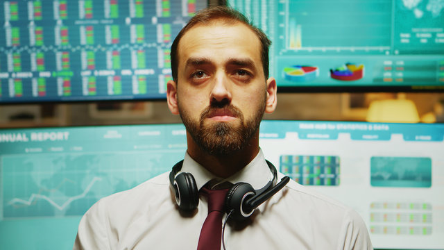 Stock market trader using augmented reality. Company crash. Multiple displays with real time financial data in the background