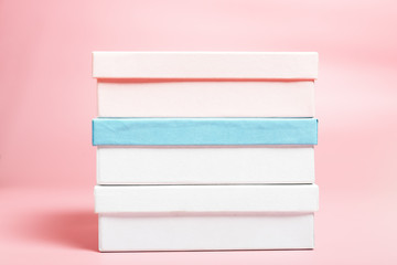  Three boxes on a pink background. Shopping concept, seasonal sale. Background for text.