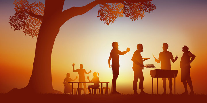 Concept d’un moment de convivialité, avec un groupe d’amis réunies autour d’un barbecue, pour passer un moment de détente sous le soleil d’une journée d’été.