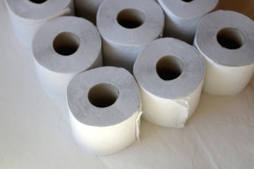 Stack of toilet paper, made with recycled paper. Selective focus.