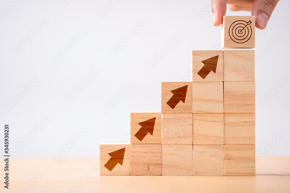 Poster hand putting print screen dart and target board wooden cube on up arrows. target of investment and b