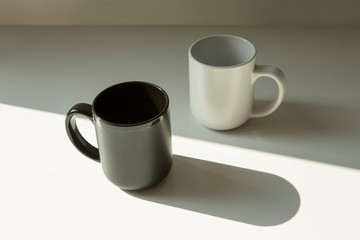 black and white mugs light and shadow