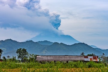 Naklejka na ściany i meble Mt. Agung spewing smoke in bali