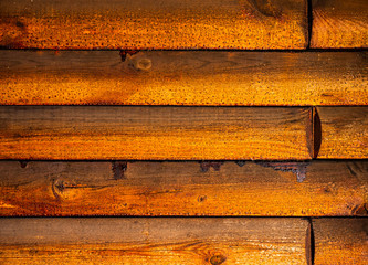 Background of golden wooden boards with knots