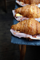 Delicious croissant pastry stuffed with ham and cheese