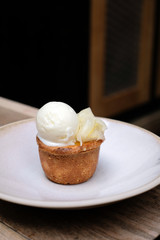 Delicious dessert, hot salted caramel pudding with lemon ice-cream and fennel