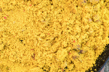 Seafood paella cooked in a large pan wok, street food festival. Mexican fiesta