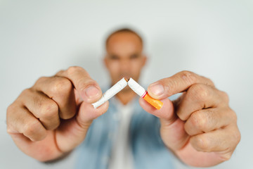 Man hand crushing cigarette, Concept Quitting smoking,World No Tobacco Day.