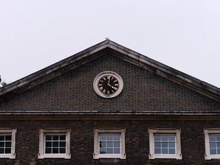 Fototapeta premium Roof of old house with clock