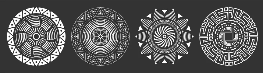 Ingelijste posters Afrikaanse Motieven Set of four abstract circular ornaments. Decorative patterns isolated on black background. Tribal ethnic motifs. Stylized sun symbols. Stencil tattoo and prints Vector monochrome illustration.  © Andrey