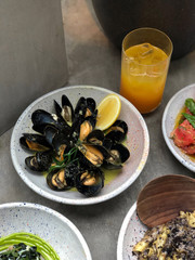 Delicious plate of fresh boiled mussels served with lemon