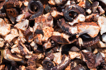 Octopus small chopped bites, street food festival. Seafood festival.