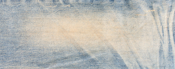 Blue denim jeans texture banner with copy space for text design background. Canvas denim fashion texture. Panoramic fashion banner