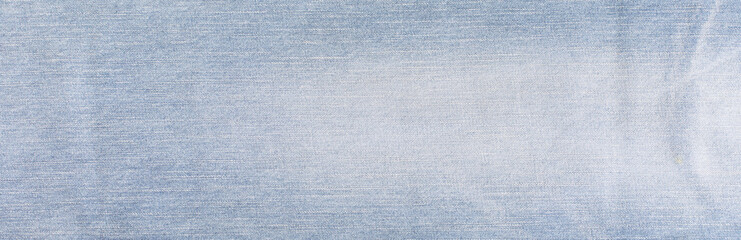 Blue denim jeans texture banner with copy space for text design background. Canvas denim fashion texture. Panoramic fashion banner