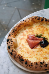 Delicious soughdough pizza with mozzarella and ham