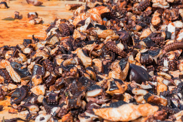 Octopus small chopped bites, street food festival. Seafood festival.