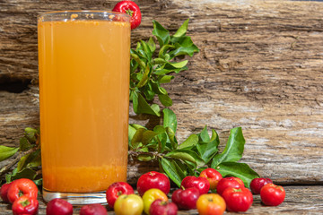 Natural juice of acerola (Malpighia emarginata). Tropical fruit. Drink based on aceroleira fruits. Glass. Refreshing drink. Fruits and drinks from Brazil.