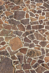 Close-up of an outdoor flooring made with irregular porphyry slabs, full frame, Italy, Europe