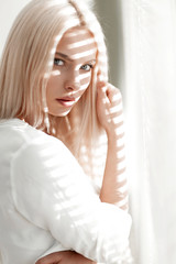 Fototapeta premium close-up of a young business woman standing near a window