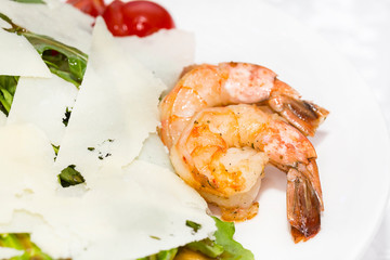 Octopus shrimp squid seafood salad close up shot in restaurant.