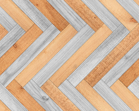 Light wood texture. Seamless parquet floor with herringbone pattern. 