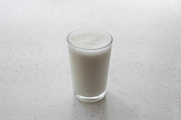 glass of cold milk on the table
