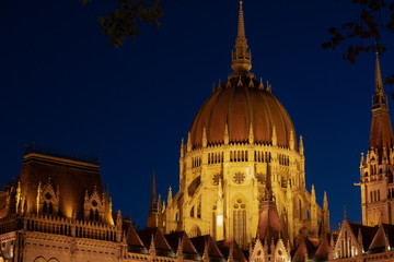 Obraz premium Hungarian Parliament building in the city of Budapest. Budapest at night time. A sample of neo-gothic architecture, Budapest tourist attraction