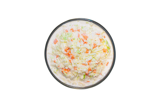 Top view of coleslaw salad in glass bowl on white background, isolated, clipping path included