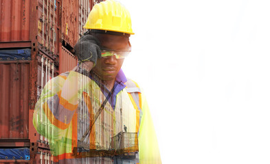 Close up of An African American handsome black engineer he is working in container box yard area