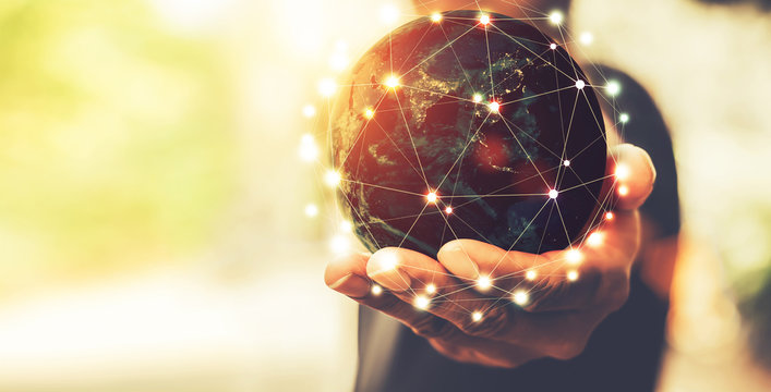 Hand holding flying earth network global connection concept, Energy and ecology concept, Elements of this image furnished by NASA