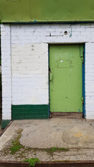 colorful wooden door. Entrance to old green door of historic building in European city Odessa of Ukraine