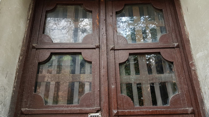 old wooden window in a church. Architecture details of ancient house with old wooden frames in windows