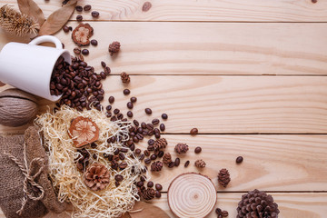 Autumn dry leaves on wooden brown background top view.