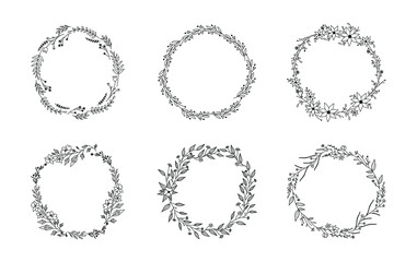 Floral circular frames and borders. Set of doodle hand drawn wreaths with flowers, leaves and plants. Vintage vector illustration