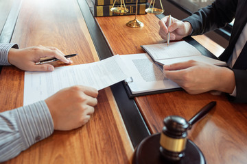 Male Notary lawyer or judge consult or discussing contract papers with Businessman client in...
