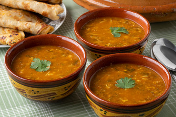 Traditional bowl of Moroccan harira close up and filled Msemmen