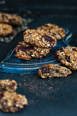 healthy dessert, fitness food, oatmeal cookies with banana on a dark table