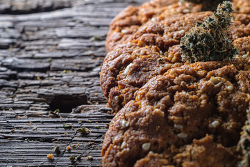 biscuits with hemp on an old wooden background close-up. rustic. Horizontal orientation.