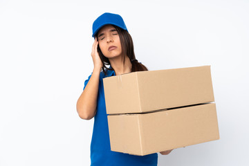 Young delivery brunette girl over isolated white background with headache