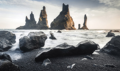 Gorgeous view of rock formations Trolls fingers in Atlantic Ocean. at Cape Dyrholaey near the...