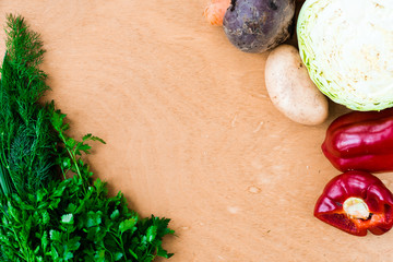 The layout of spring vegetables on a cutting board from above. Background layout with free text space.