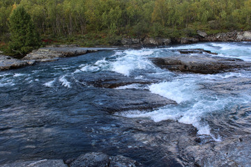 Large river in the arctic tundra. Abisko national park, Nothern Sweden