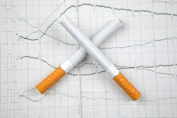 Close up of a smoking cigarettes on white