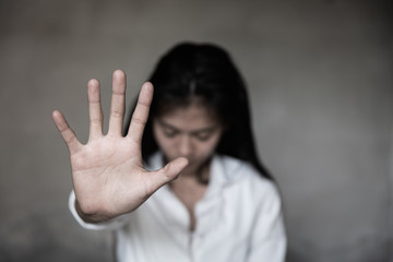 woman raised her hand for dissuade, Abuse, campaign stop violence against women. Stop sexual harassment and rape.