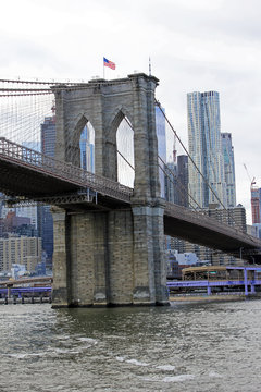 New york, USA - 20.12.2019: Brooklyn bridge in New York, Manhattan skyscrapers skyline behind across Hudson river at end of day New York, USA - stock photo
