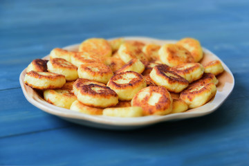 Cheesecakes or Syrniki on a plate. Russian and Ukrainian Cuisine	