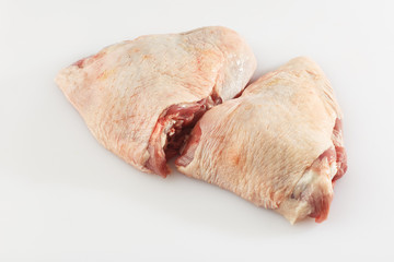 Raw Free range Boneless skinless chicken thighs on stone table. Raw chicken thigh . The view from...