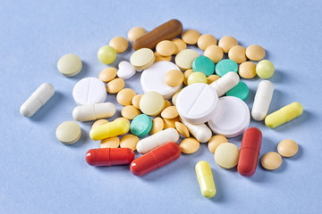 Many multi-colored pills, tablets and capsules