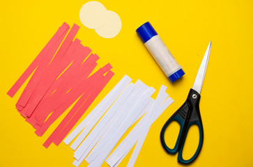 How to make a flower out of paper at home. Children's DIY art project. Step 2 Cut the colored paper into strips.